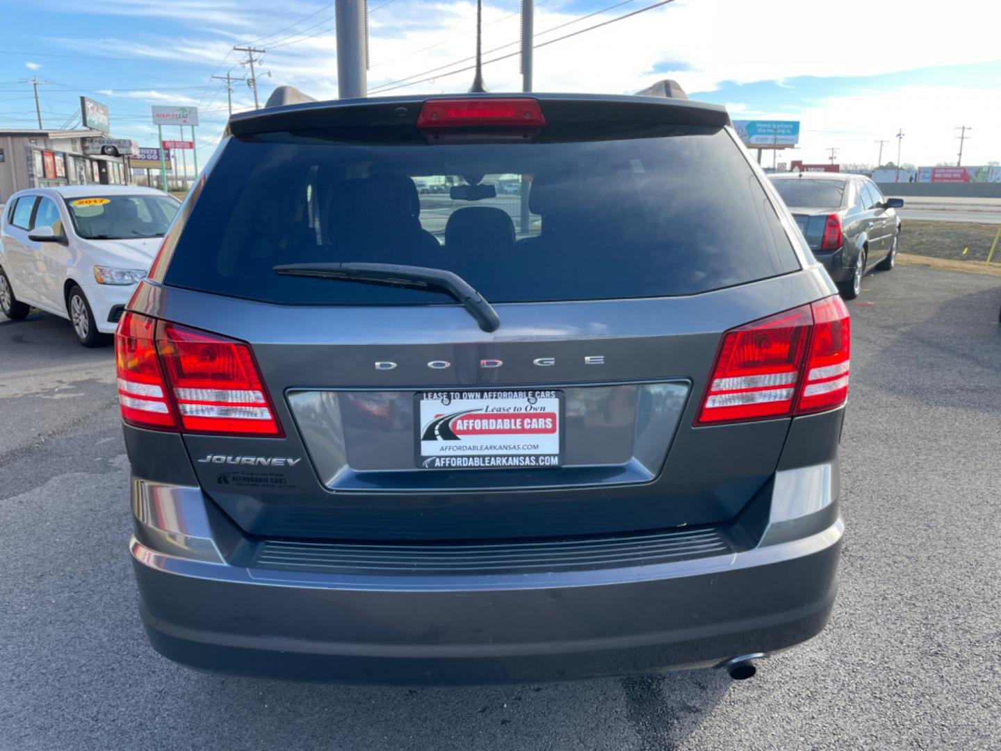 2017 Gray Dodge Journey (3C4PDCAB5HT) with an 4-Cyl, 2.4 Liter engine, Auto, 4-Spd AutoStick transmission, located at 8008 Warden Rd, Sherwood, AR, 72120, (501) 801-6100, 34.830078, -92.186684 - Photo#6